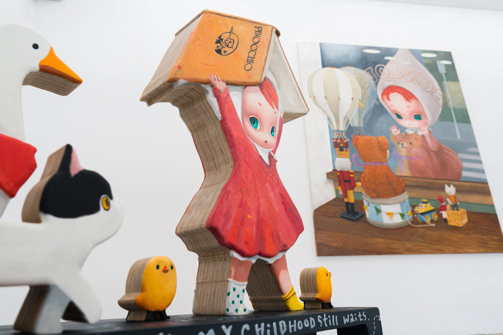 Carrying a Tale, MANE, 2025Painted wood sculpture120.0 × 30.0 × 115.0 cm