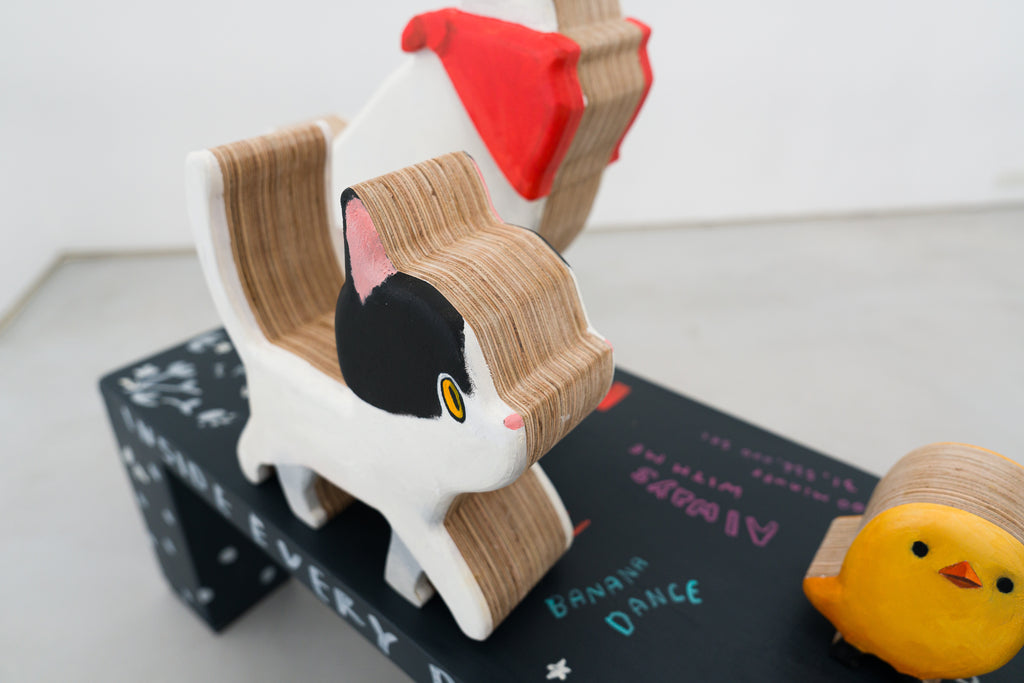 Carrying a Tale, MANE, 2025Painted wood sculpture120.0 × 30.0 × 115.0 cm